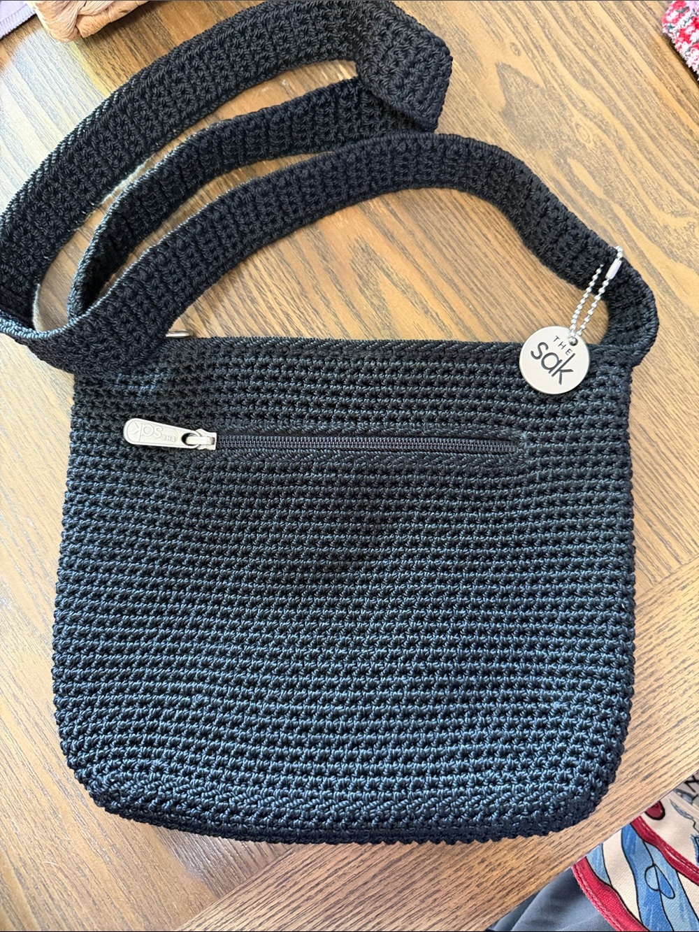 The Sak Black Crochet Crossbody Bag with Zip Pocket